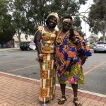 Two Ghanaian women adorned with the resplendent Kente cloth